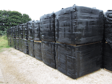 Sawdust bales are wrapped and can be stored outside without any water penetrating the bales
